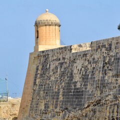 Fototapeta na wymiar Valletta Malta- A view of the 14th century city walls as seen from the Valletta City Gate.