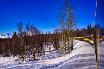 The Alaska Aurora train running in the snow. Denali National Park, Alaska, U.S.A. March 2016.