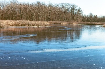 partially frozen lake in winter