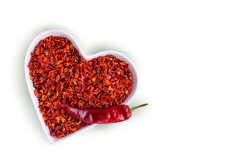 Slices of dry red pepper in a ceramic dish