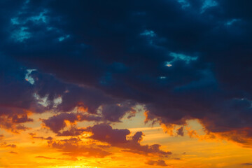 Fototapeta premium Beautiful heaven landscape, blue and orange clouds, amazing view on sunset, beauty of wonderful nature