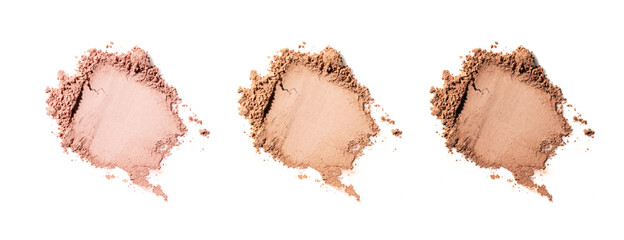 Three shades of cosmetic powder on white background.
