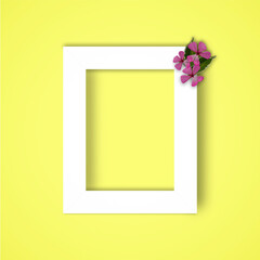 white frame on a yellow background. empty frame. flat lay. photo frame mockup. minimalistic background