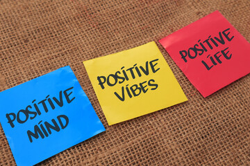 Positive mind vibes life, text words typography written on paper against wooden background,...