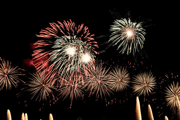 Real fireworks on deep black background sky, beautiful colorful fireworks shiny display at night