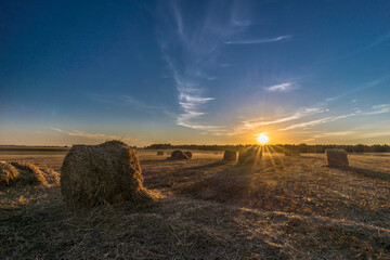 Setting sun over harvest fields in Belarus