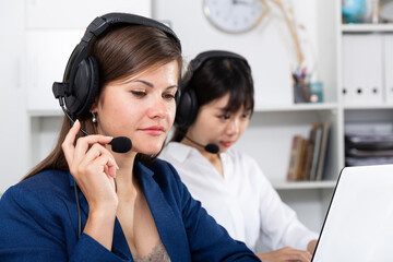 Sales assistants working with computers in an office. High quality photo