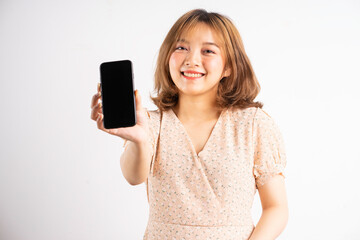 Naklejka premium Young asian girl holding phone with expressions, gestures on background