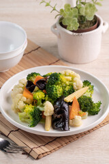 Homemade fresh boiled vegetables with cauliflower, broccoli, black fungus and baby corn.