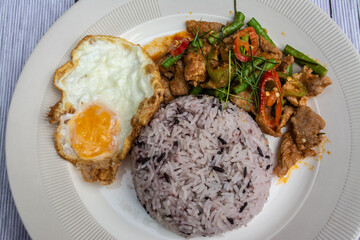 Rice with Stir Fried Chili, Pork, Fried Egg, Delicious. It is a popular for Thai Food 