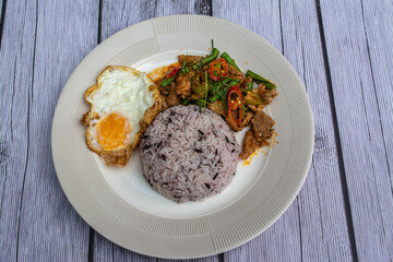 Rice with Stir Fried Chili, Pork, Fried Egg, Delicious. It is a popular for Thai Food 