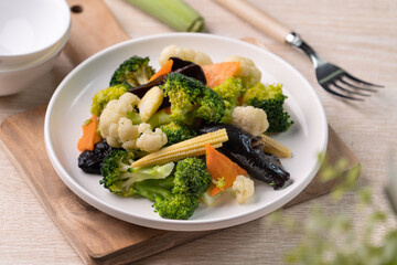 Homemade fresh boiled vegetables with cauliflower, broccoli, black fungus and baby corn.