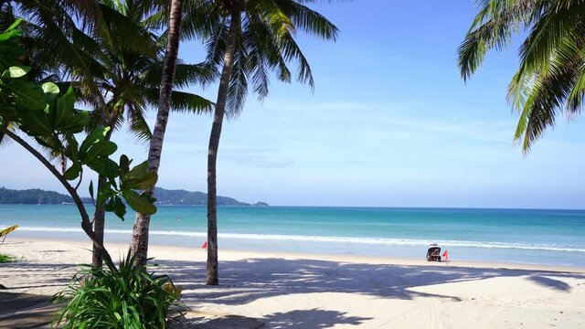 Empty beach Tropical sea scenic off Patong beach in phuket thailand with coconut palm trees frame,New normal after covid-19 Phuket beach is famous tourist destination at Andaman sea