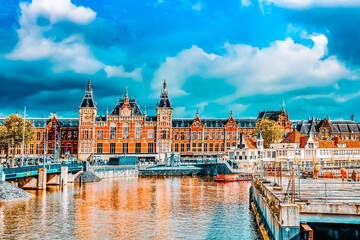 AMSTERDAM, NETHERLANDS - SEPTEMBER 15, 2015: Beautiful buildings Amsterdam Central station.(Station Amsterdam Centraal). Amsterdam Centraal was designed by Pierre Cuypers