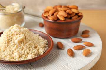 Plate with almond flour on table
