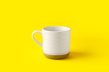 Empty cup on color background