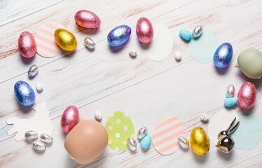 Fototapeta na wymiar Beautiful composition with chocolate Easter eggs on wooden background