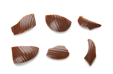 Pieces of broken chocolate Easter egg on white background