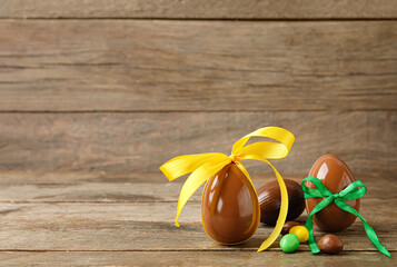 Chocolate Easter eggs on wooden background