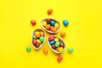 Composition with chocolate Easter eggs on color background