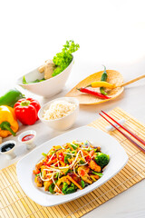 sweet and sour chicken with rice and vegetables