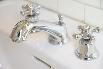 Hot and cold water faucets in the bathroom