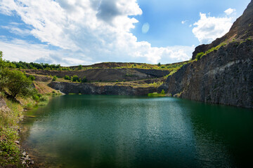 the emerald green lake between the rocks of the mountain