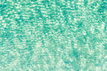 Ripple Water in swimming pool with sun reflection