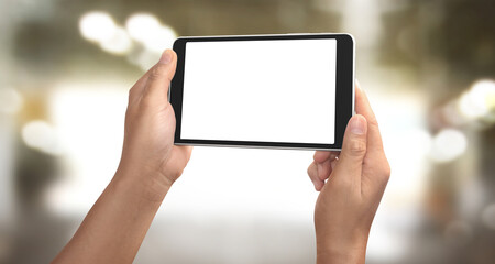 Hands holding a tablet touch computer gadget