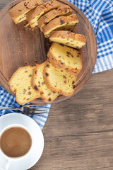 Sliced sultana pie served with a cup of coffee