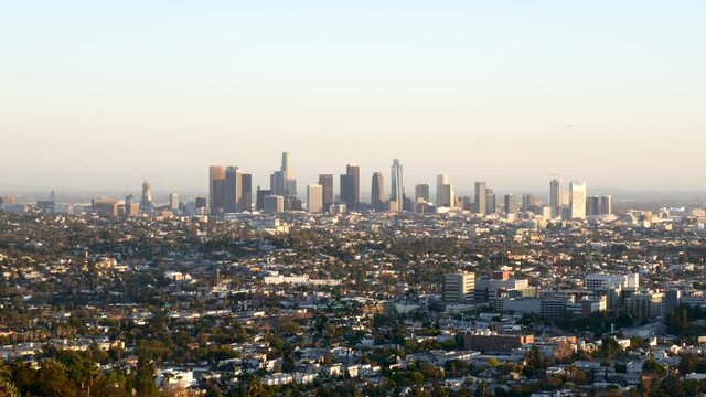 Handheld footage of downtown Los Angeles skyline at golden hour.