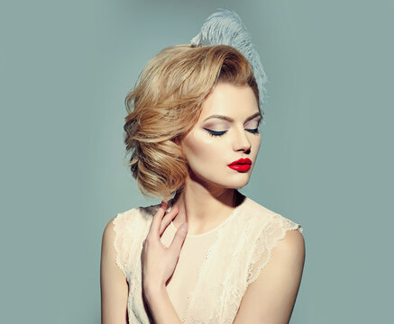 Retro woman, vintage look. Pinup makeup and cosmetics. Sensual blond girl with elegant makeup. Beauty, old fashion.