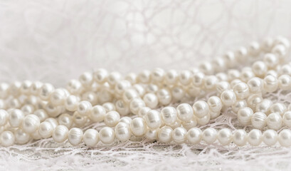 Nature white string of pearls in soft focus, with highlights
