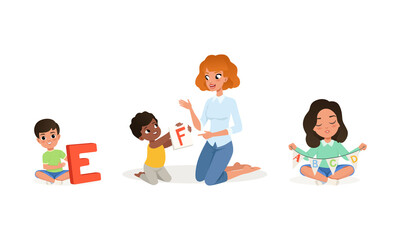 Cute Little Boys and Girls Studying Alphabet with Their Teacher Set, Elementary Students and Tutor Sitting on Floor in Kindergarten, Kids Education and Upbringing Vector Illustratio