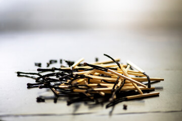 Fototapeta premium pile of burnt matches on blurred backgrounbd. concept of loss and end