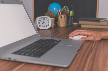 Human hands are using computers to work and communicate.