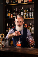 Portrait elderly bartender man with fresh delicious cocktail