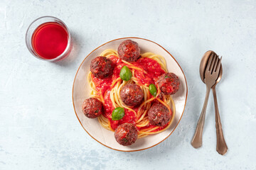 Meatballs with pasta and wine, overhead flat lay shot. Meatballs with tomato sauce and basil