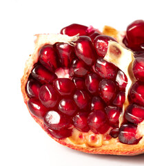 Ripe red pomegranate on a white