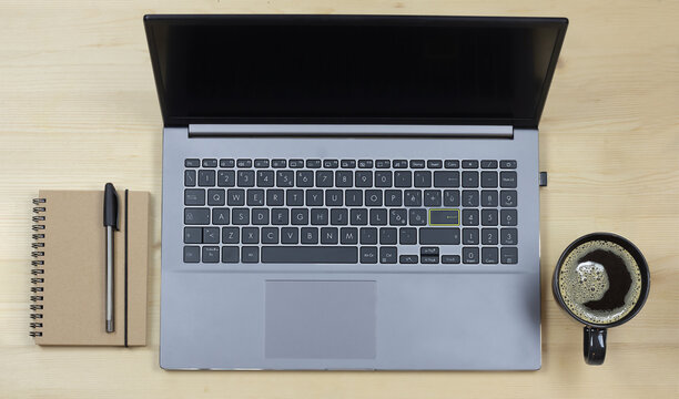 laptop , block notes, pen, coffe, wood background