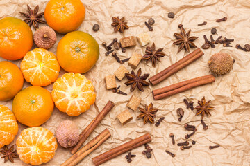 Fototapeta na wymiar Whole and peeled tangerines and spices.