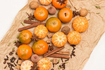 Whole  and peeled tangerines and spices. Cinnamon sticks and  star anise