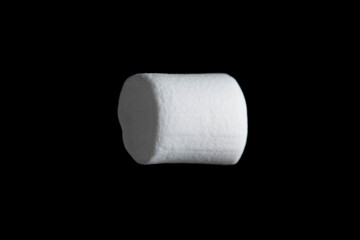 White marshmallow on black background.