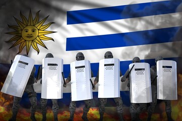 Uruguay protest fighting concept, police special forces in heavy smoke and fire protecting state against disorder - military 3D Illustration on flag background