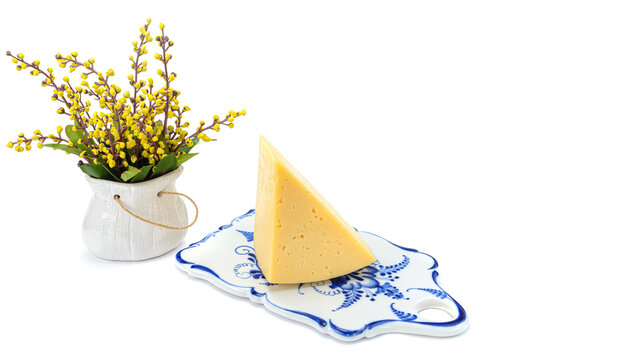 Solid yellow gouda cheese, close-up, isolated on a white background.selective focus.
