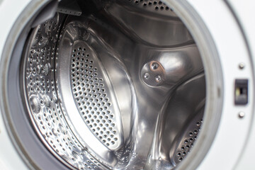 Drum of washing machine dry and clean close-up.