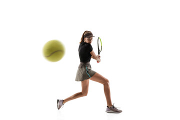 Catching. Young caucasian professional sportswoman playing tennis isolated on white background. Training, practicing in motion, action. Power and energy. Movement, ad, sport, healthy lifestyle concept