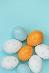 Easter holiday.Multicolored easter eggs set on a light blue background.Spring festive easter background. copy space.