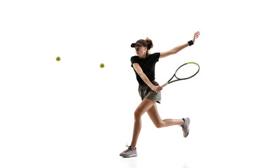 Youth. Young caucasian professional sportswoman playing tennis isolated on white background. Training, practicing in motion, action. Power and energy. Movement, ad, sport, healthy lifestyle concept.