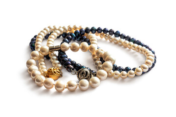 Two pearl necklaces with light and dark pearls